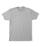 Photo of a flat grey soft t-shirt with a black "THE LOMAS BRAND" written in a stylized circle on the lower left of the shirt. The shirt is blank otherwise. 