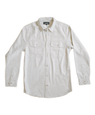 Beige white long-sleeved button-up shirt. It has a classic collar and two chest pockets with button closures. The shirt has a relaxed, casual style with a straight cut. There's a small black label visible at the collar, The Lomas Brand is printed on the tag in white. The shirt is presented flat against a plain white background, giving it a clean, minimalist look.