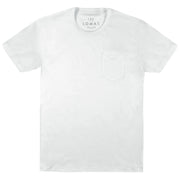 Flat shot of a blank white pocket tee. "THE LOMAS BRAND" is printed as a tag on the inside back collar, in grey.